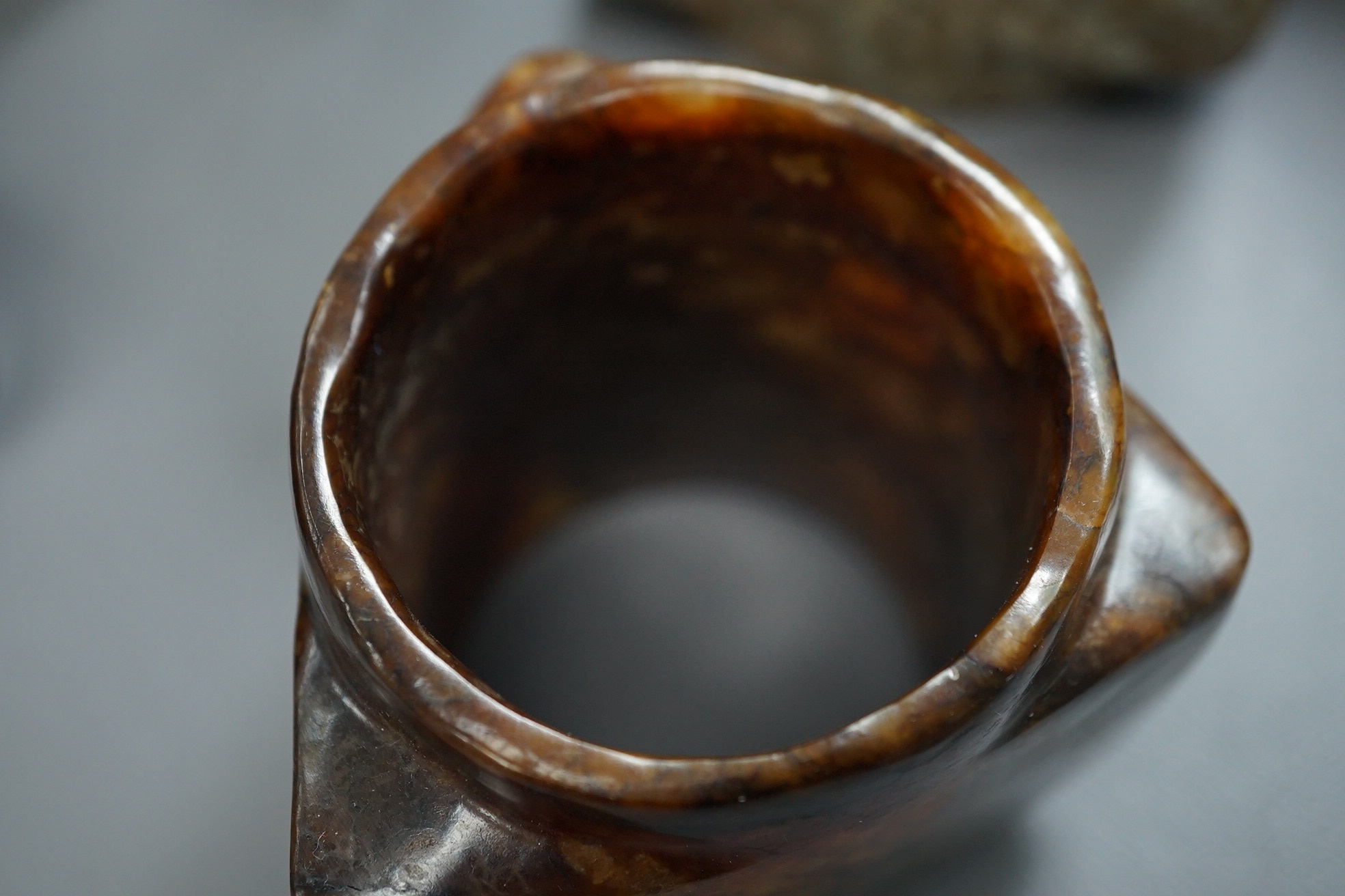 Four Chinese archaistic jade or hardstone cong
